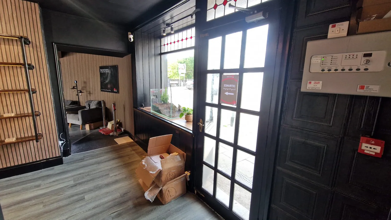 The shop door open onto the street at Priory Street.